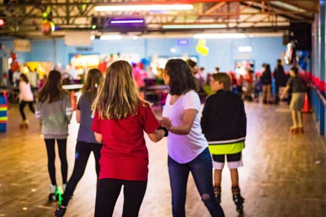 Teens skating at Sky-Vue Skateland