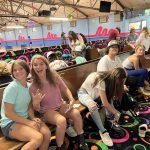 Young teens putting their skates on at Sky-Vue Skateland